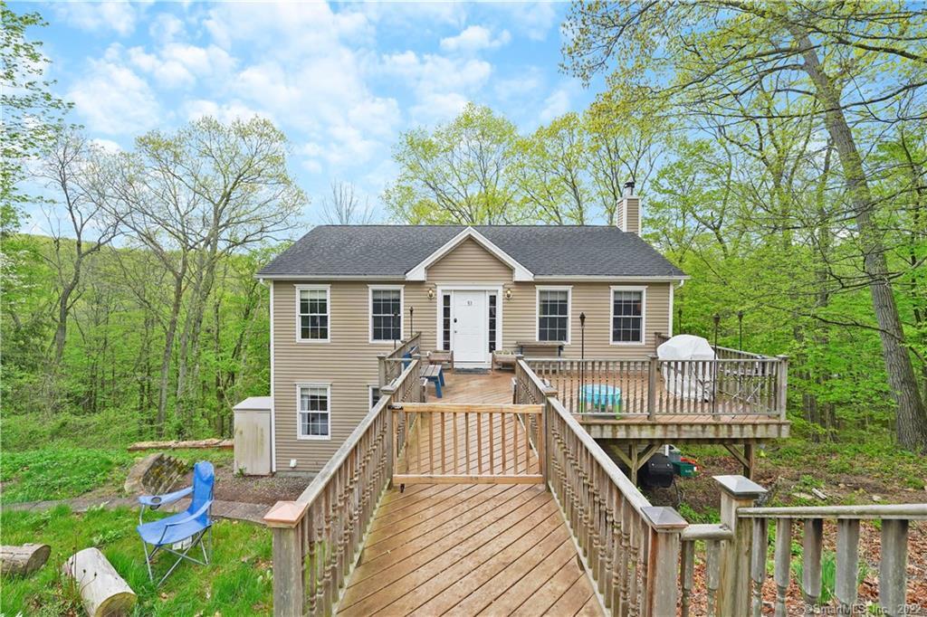 a view of house with a roof deck