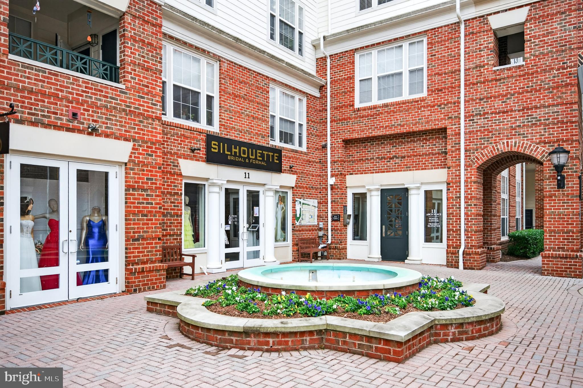16 Granite Place, Unit 280 Gaithersburg, MD 20878 - Photo 39 of 47 a front view of a house with a yard table and chairs