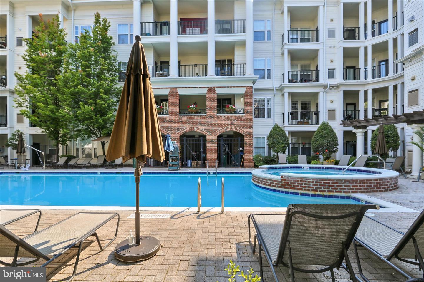 16 Granite Place, Unit 280 Gaithersburg, MD 20878 - Photo 40 of 47 a view of a patio with table and chairs and potted plants