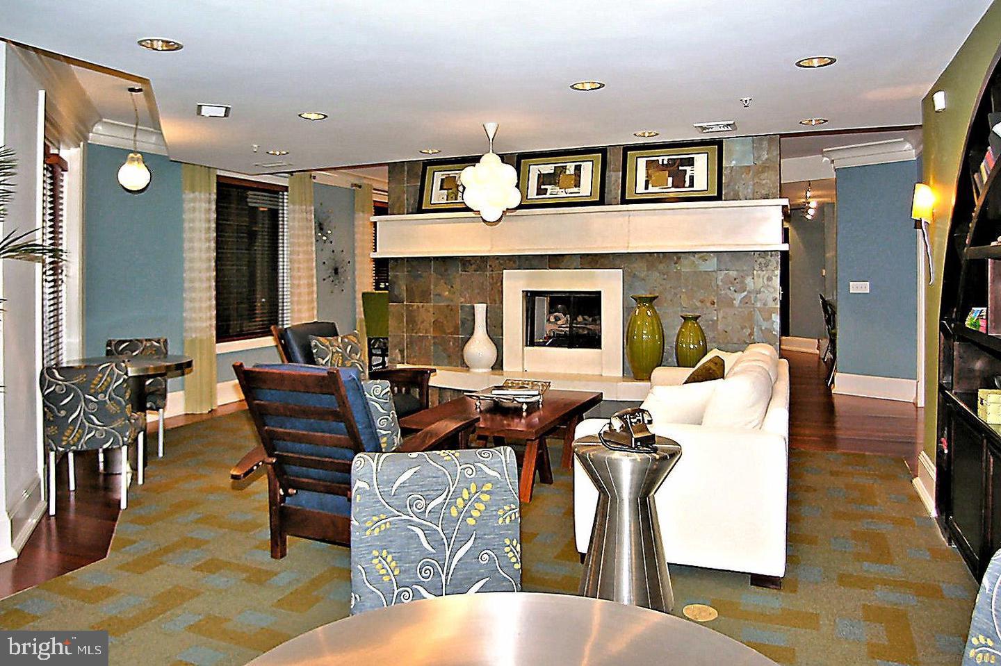 16 Granite Place, Unit 280 Gaithersburg, MD 20878 - Photo 45 of 47 a living room with furniture a dining table and chairs