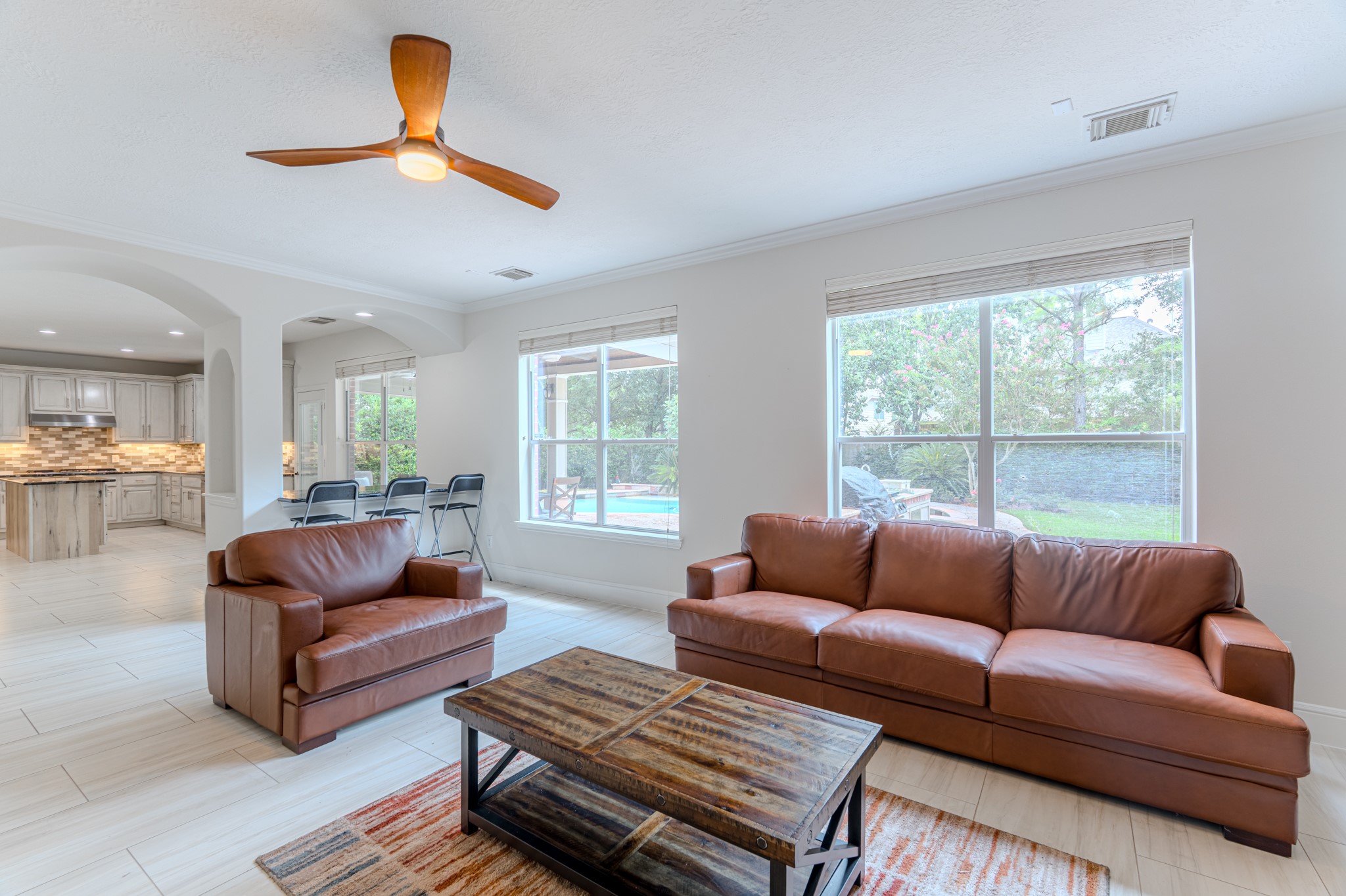 7 Stickley Court The Woodlands, TX 77382 - Photo 16 of 33 a living room with furniture and a large window