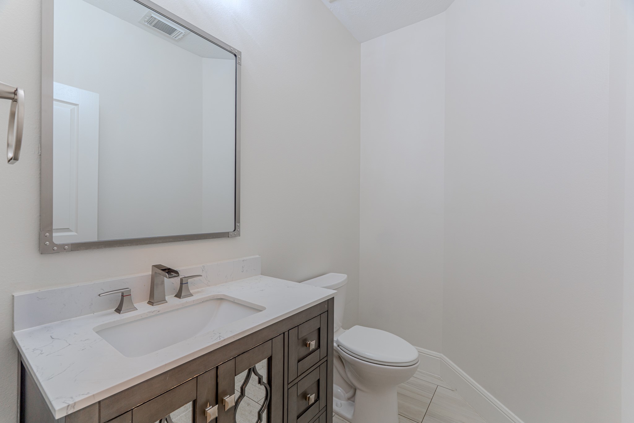 7 Stickley Court The Woodlands, TX 77382 - Photo 20 of 33 a bathroom with a sink and a toilet