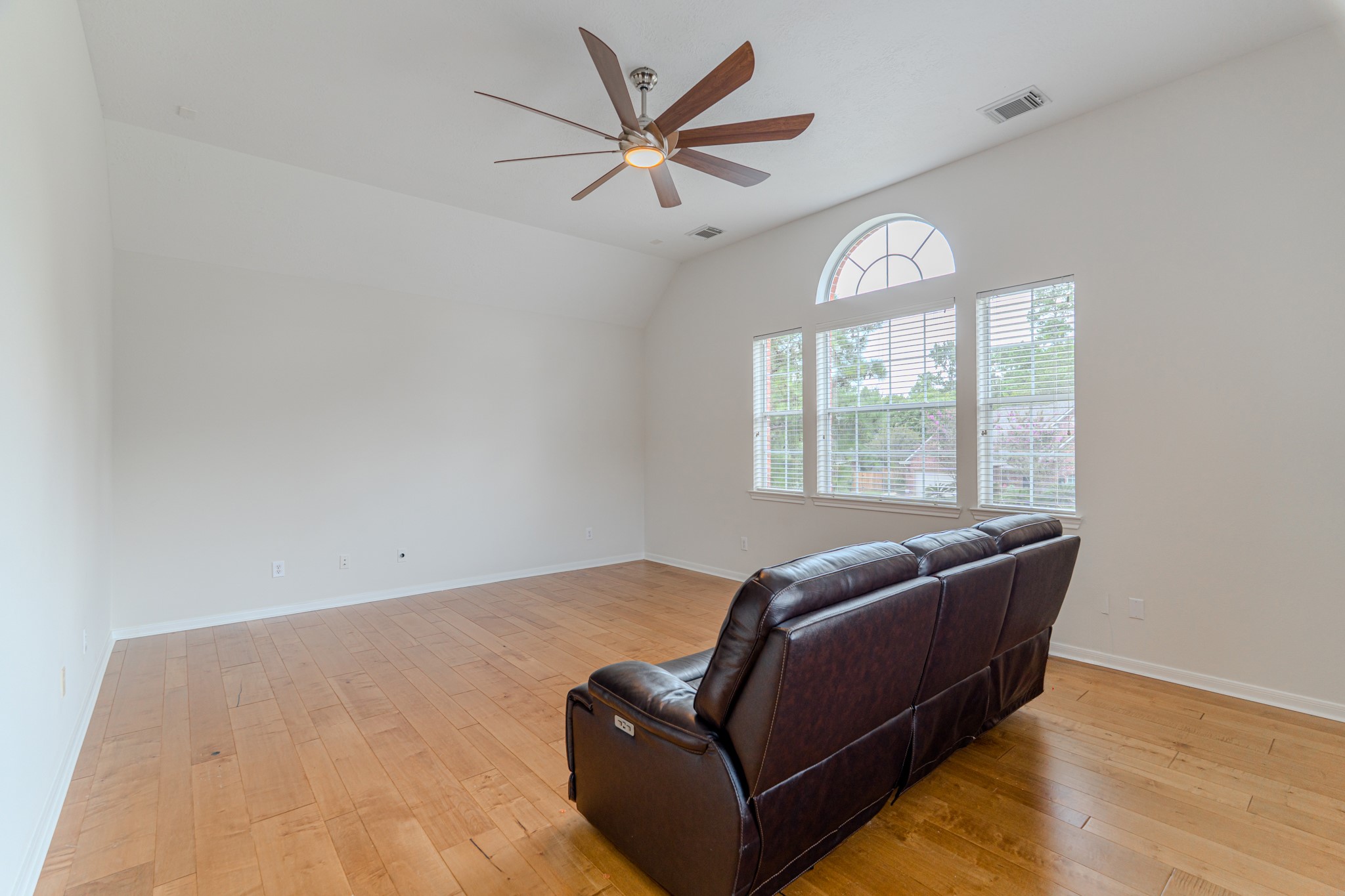 7 Stickley Court The Woodlands, TX 77382 - Photo 26 of 33 a living room with furniture and a large window