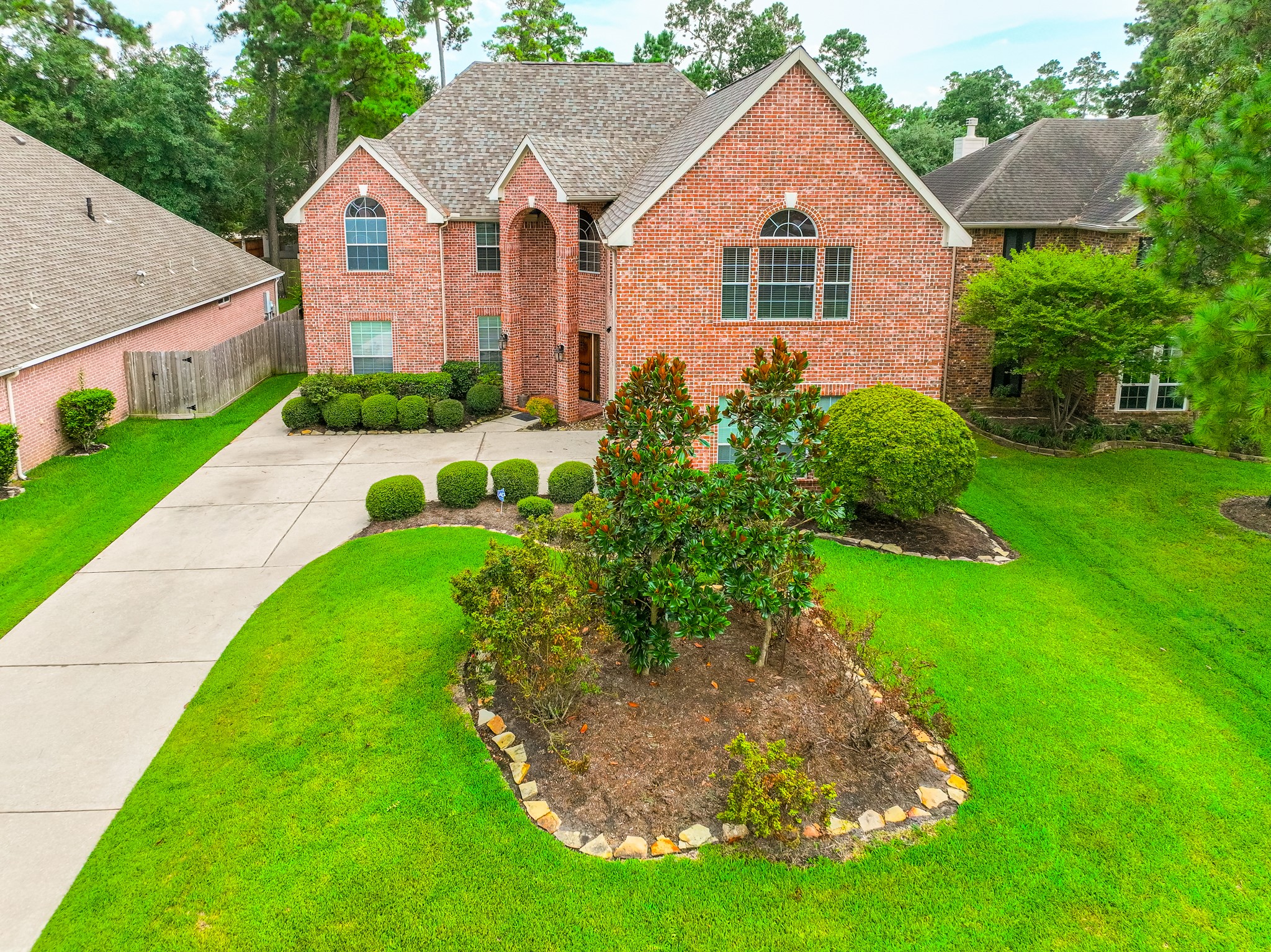 7 Stickley Court The Woodlands, TX 77382 - Photo 33 of 33 a front view of house with yard and green space