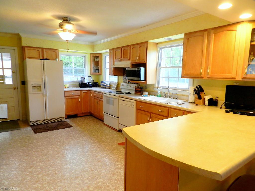 5406 Mockingbird Road Greensboro, NC 27406 - Photo 12 of 30 Bright, airy kitchen ready for a new cook!