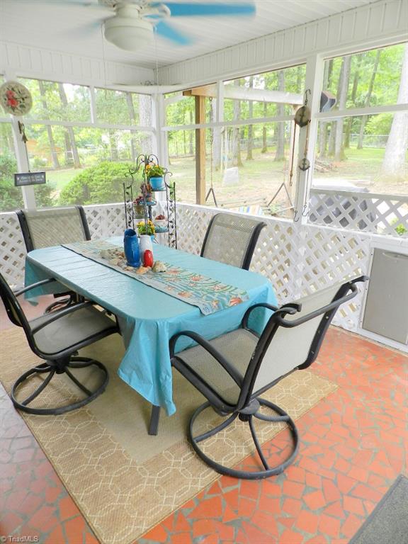 5406 Mockingbird Road Greensboro, NC 27406 - Photo 27 of 30 Pretty screened porch is a perfect place for summer cookouts! Also fenced back yard is a plus!