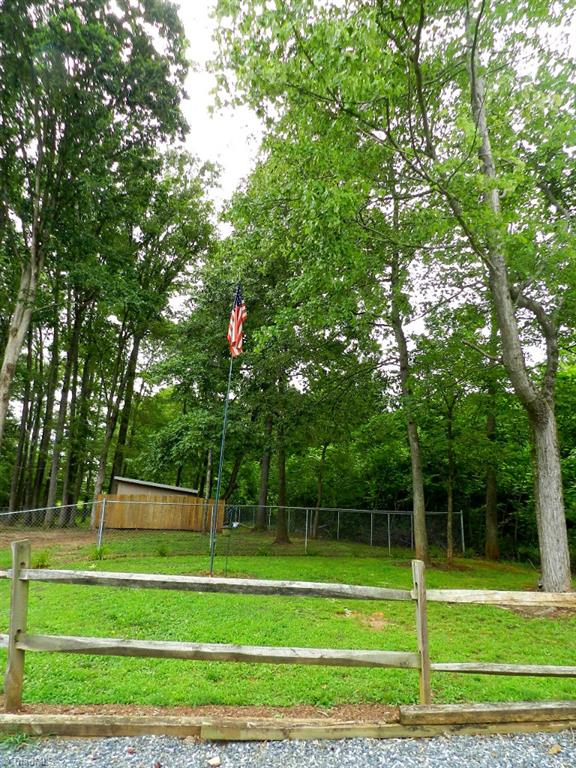 5406 Mockingbird Road Greensboro, NC 27406 - Photo 29 of 30 Large homesite, lots of parking space and great space for yard games and summer fun!