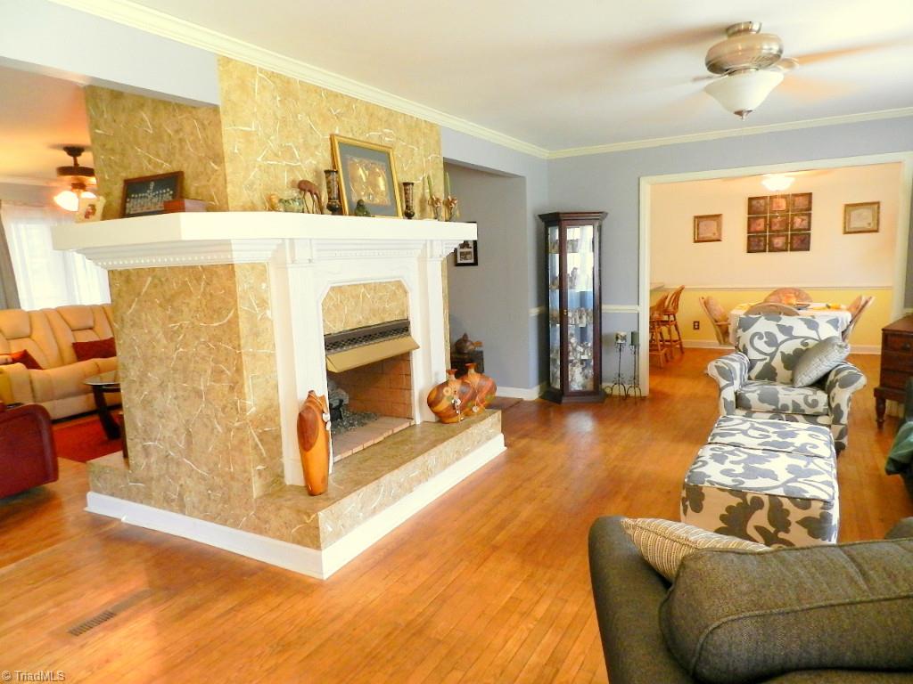 5406 Mockingbird Road Greensboro, NC 27406 - Photo 4 of 30 Living room with gas log fireplace also opens to den!