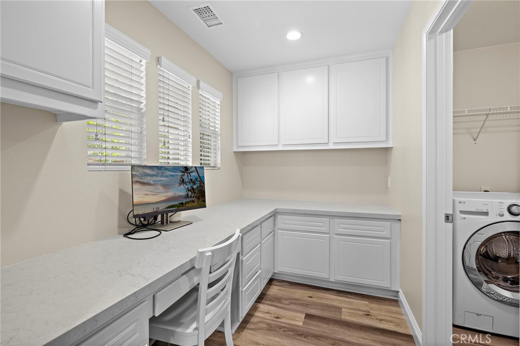 71 Sklar Street Ladera Ranch, CA 92694 - Photo 14 of 55 a view of a kitchen with sink washer and dryer
