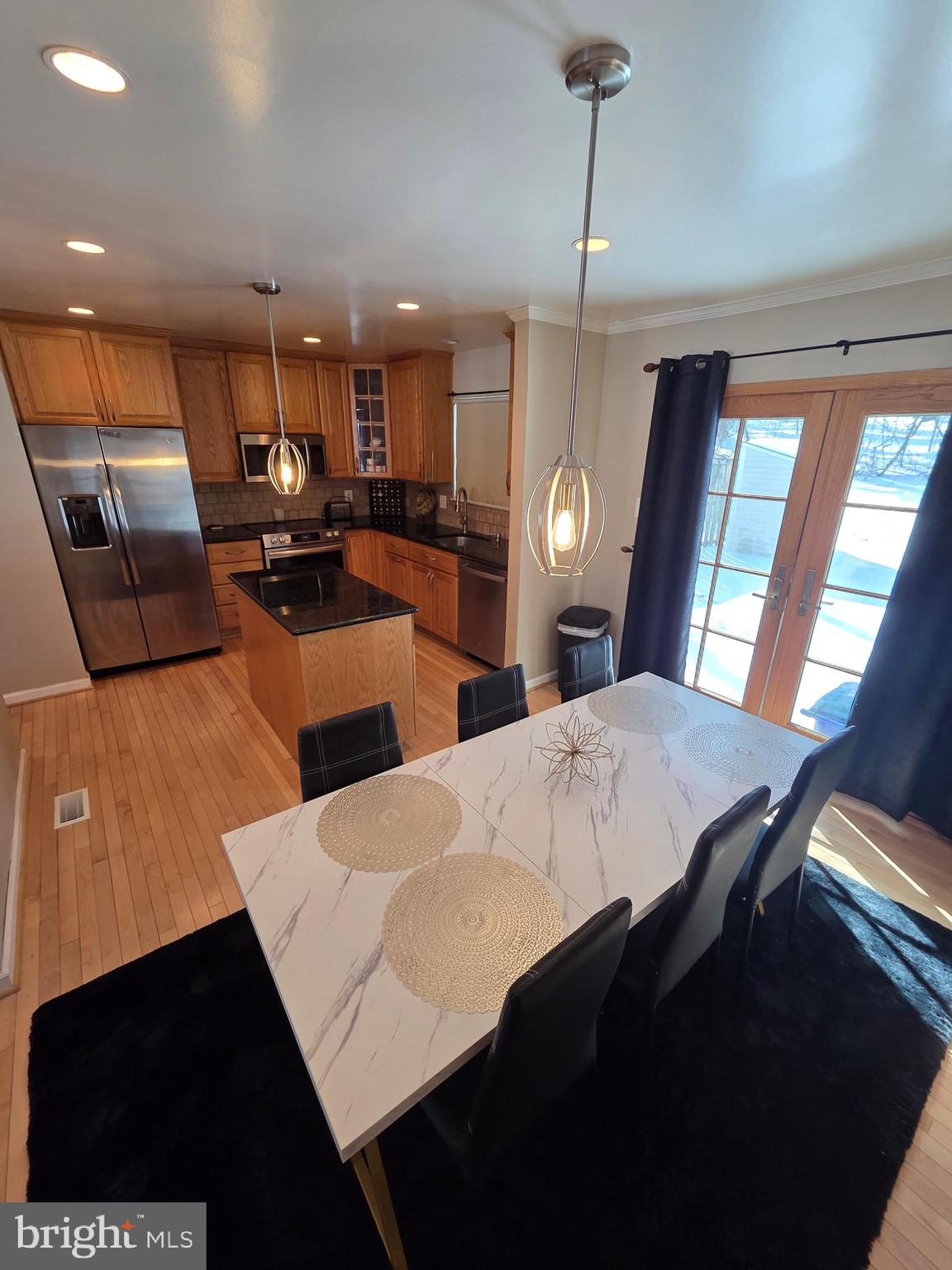 2122 Princess Anne Court Bowie, MD 20716 - Photo 11 of 37 a large kitchen with a table and chairs
