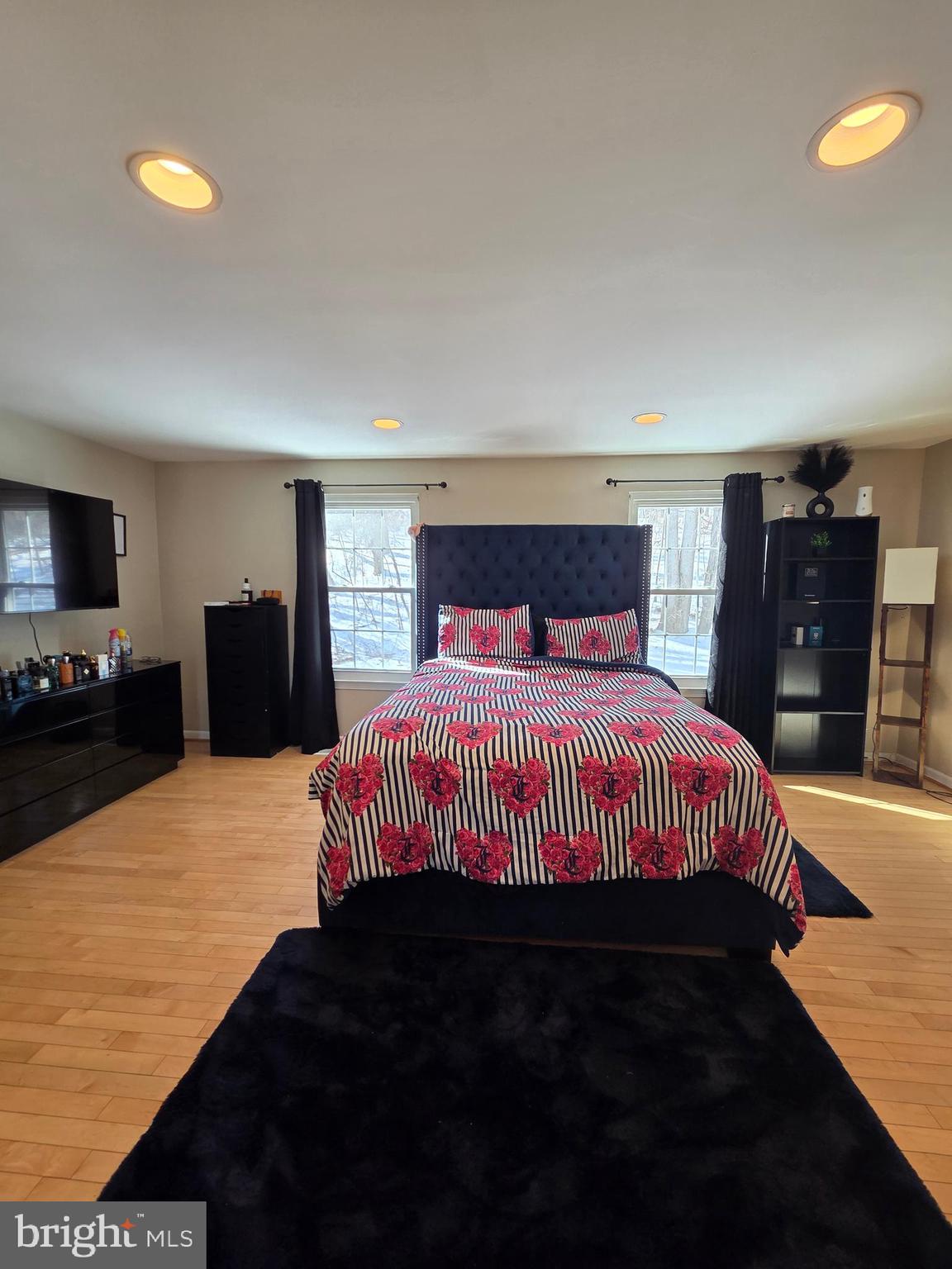 2122 Princess Anne Court Bowie, MD 20716 - Photo 17 of 37 a bedroom with a bed and wooden floor