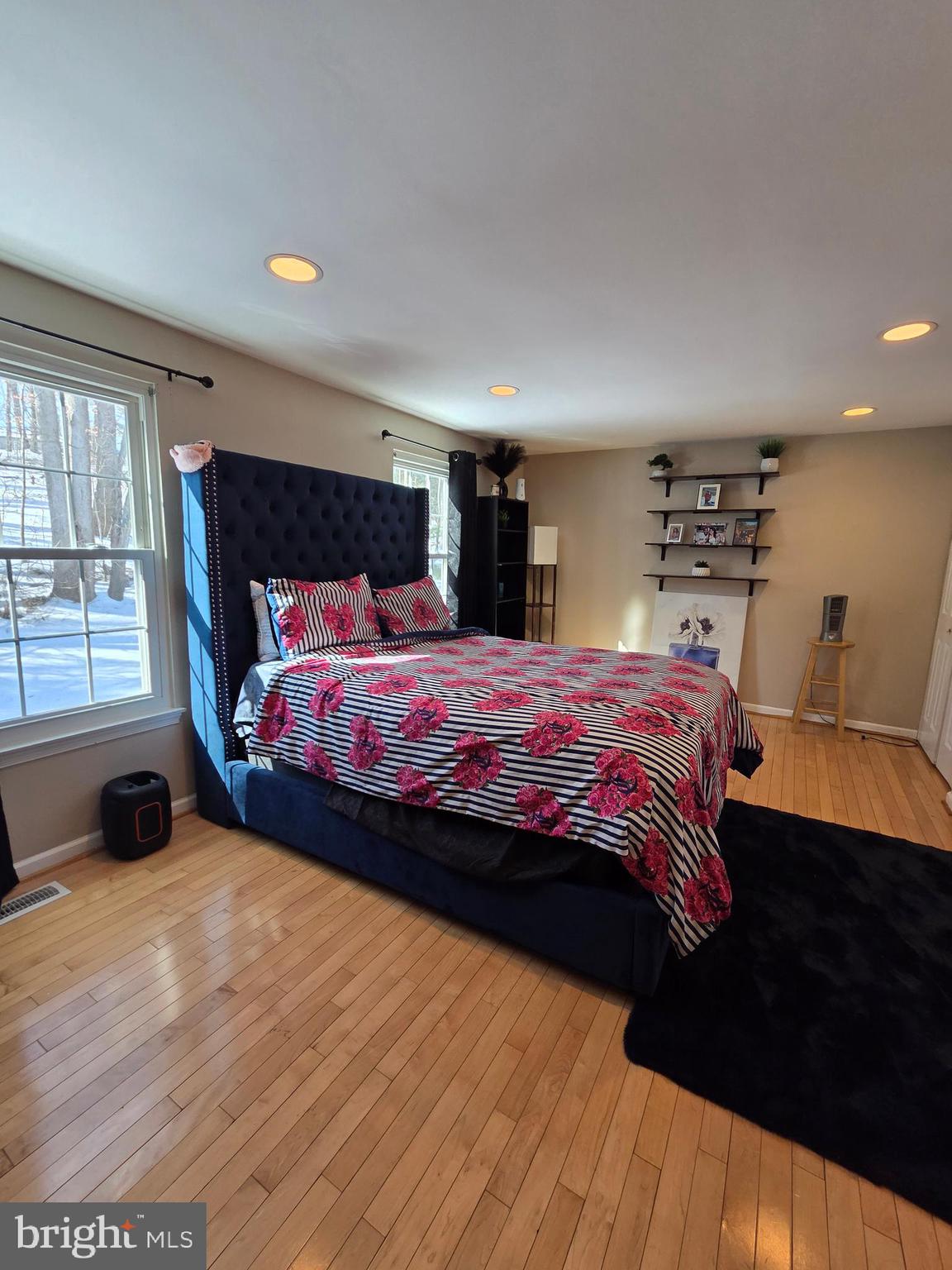 2122 Princess Anne Court Bowie, MD 20716 - Photo 18 of 37 a bedroom with a bed and wooden floor