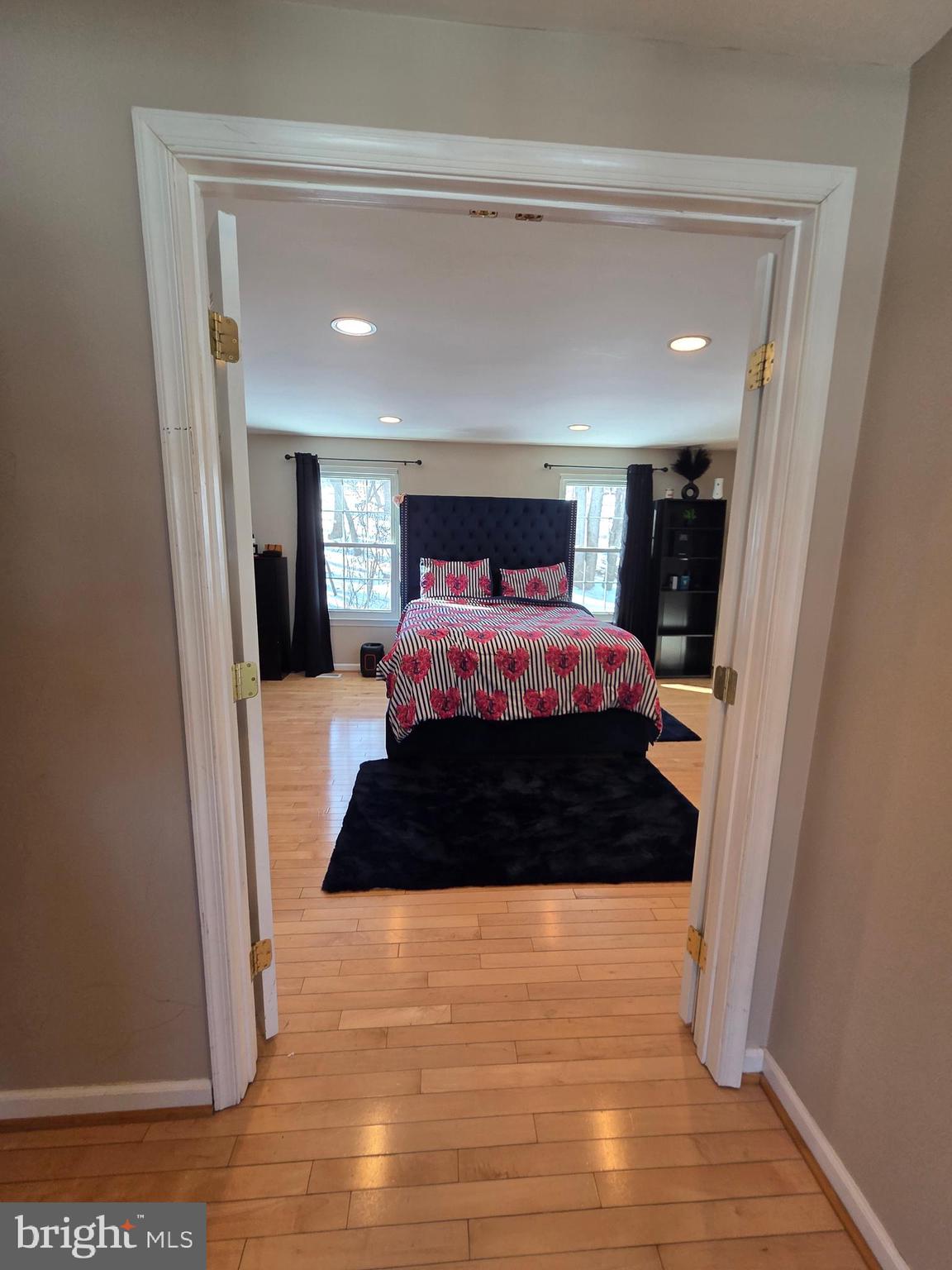 2122 Princess Anne Court Bowie, MD 20716 - Photo 19 of 37 a large bed sitting in a bedroom next to a window