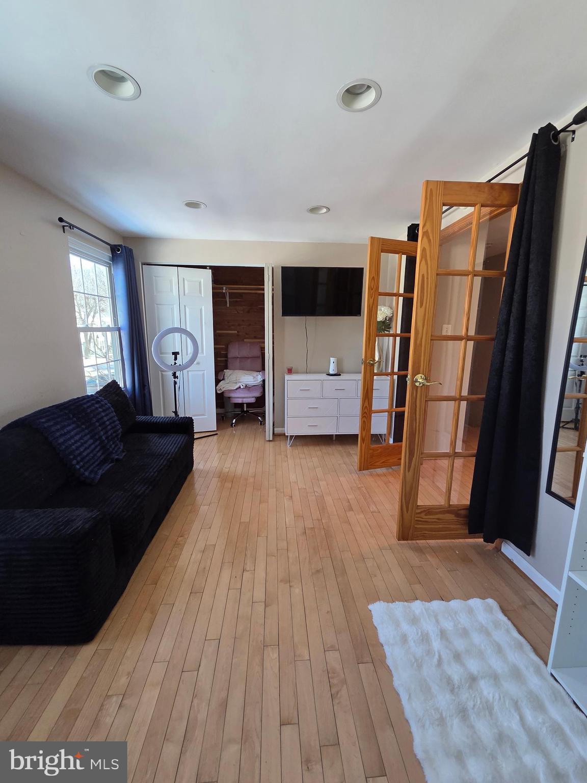 2122 Princess Anne Court Bowie, MD 20716 - Photo 24 of 37 a living room with furniture and a flat screen tv