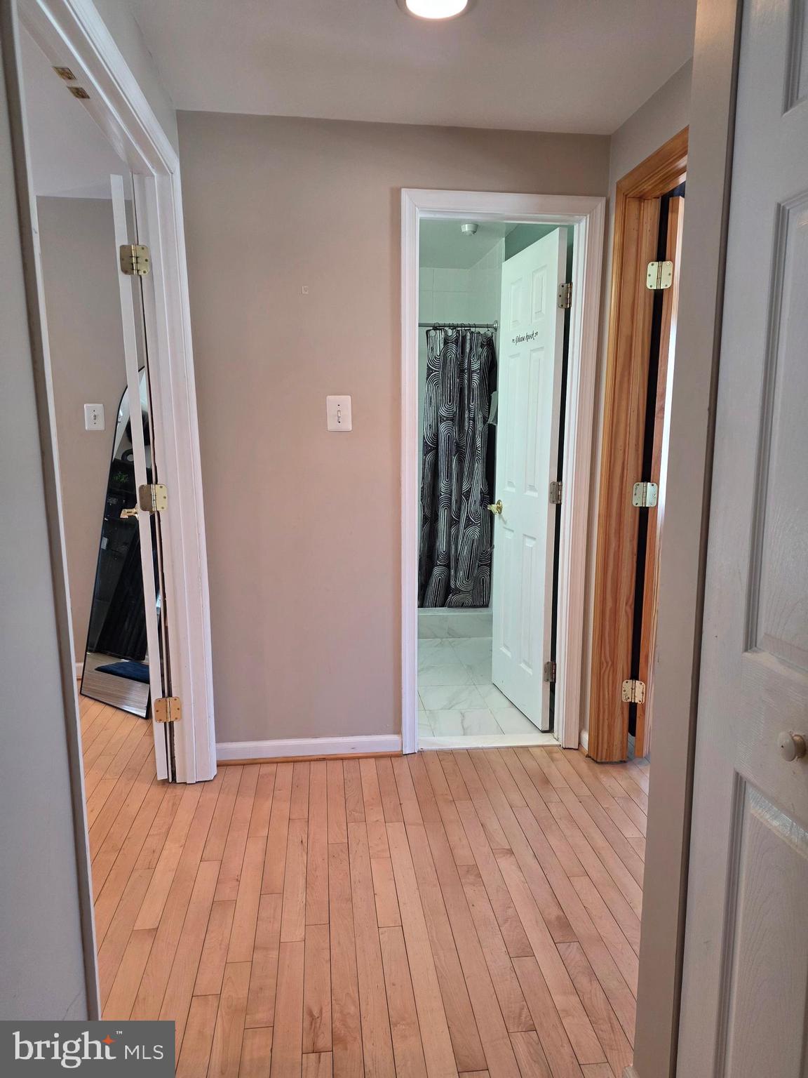 2122 Princess Anne Court Bowie, MD 20716 - Photo 26 of 37 a view of a hallway with wooden floor