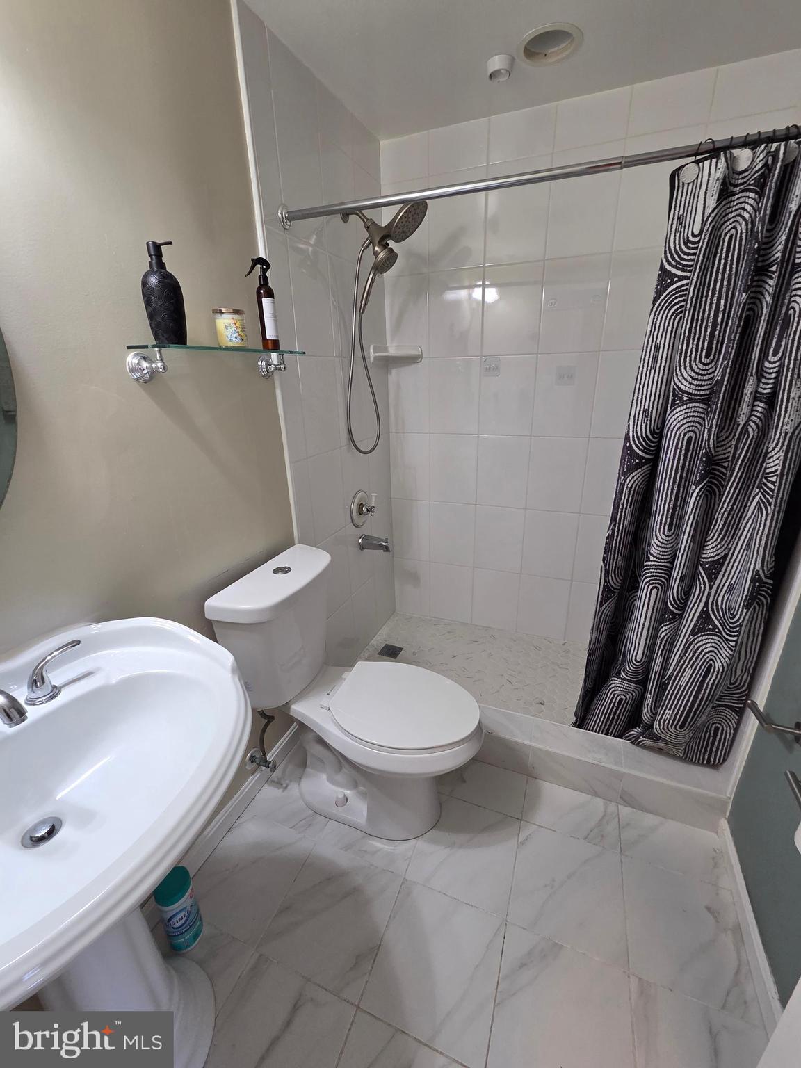 2122 Princess Anne Court Bowie, MD 20716 - Photo 27 of 37 a white toilet sitting next to a bathroom sink