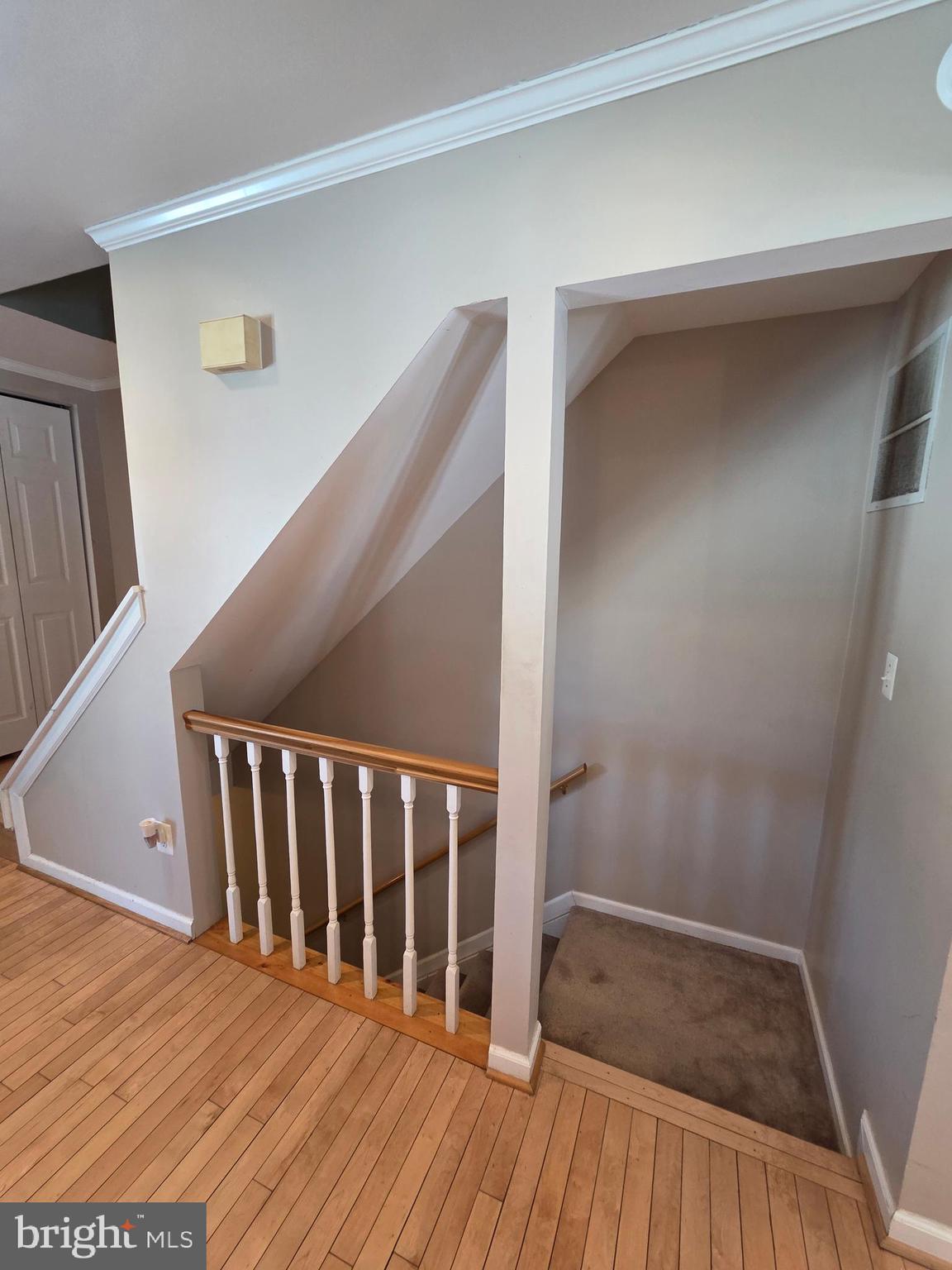 2122 Princess Anne Court Bowie, MD 20716 - Photo 30 of 37 a view of a hallway with wooden floor