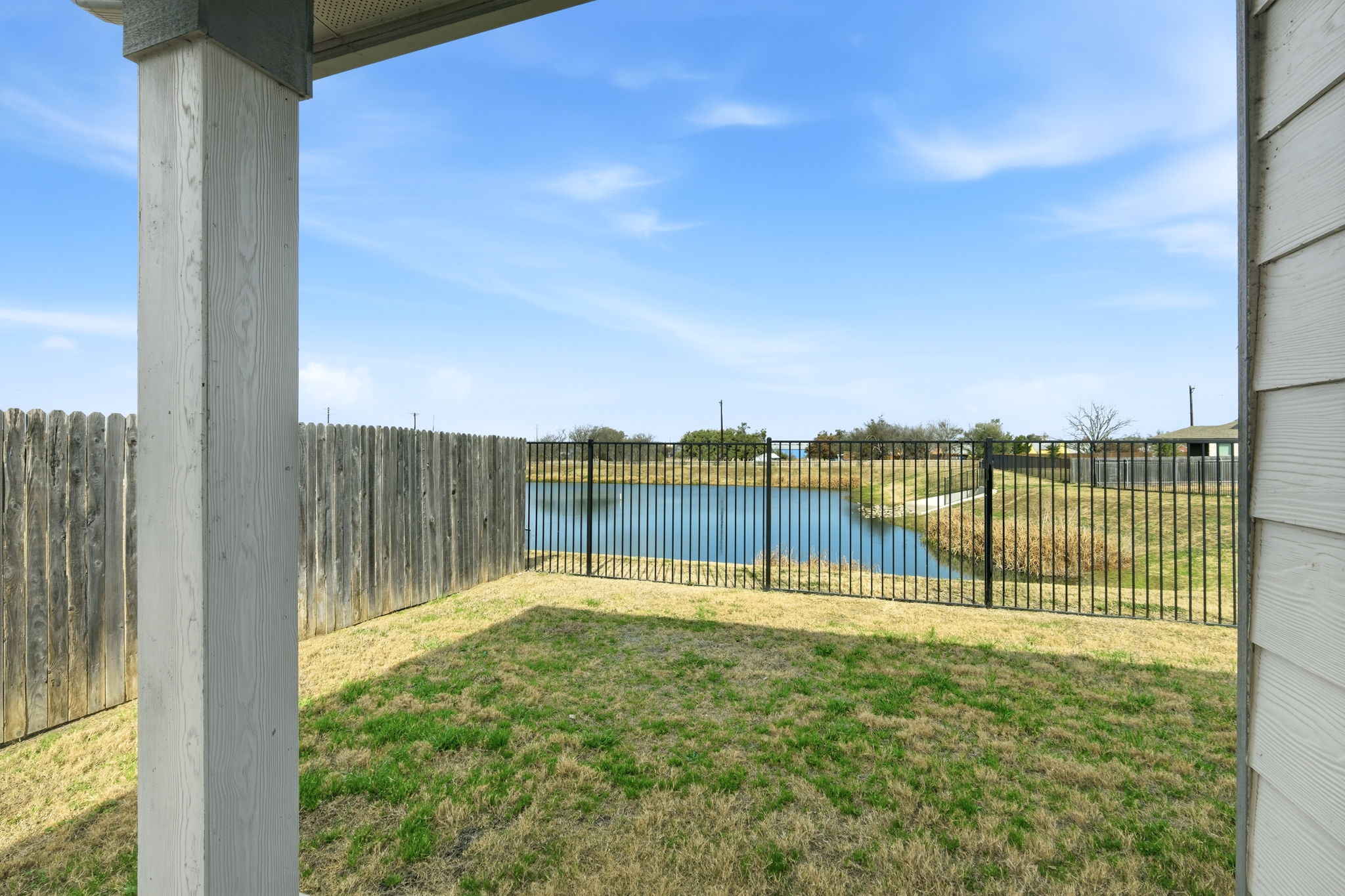 513 Thunder Valley Trail Georgetown, TX 78626 - Photo 13 of 15 Fenced backyard with a water view and a patio