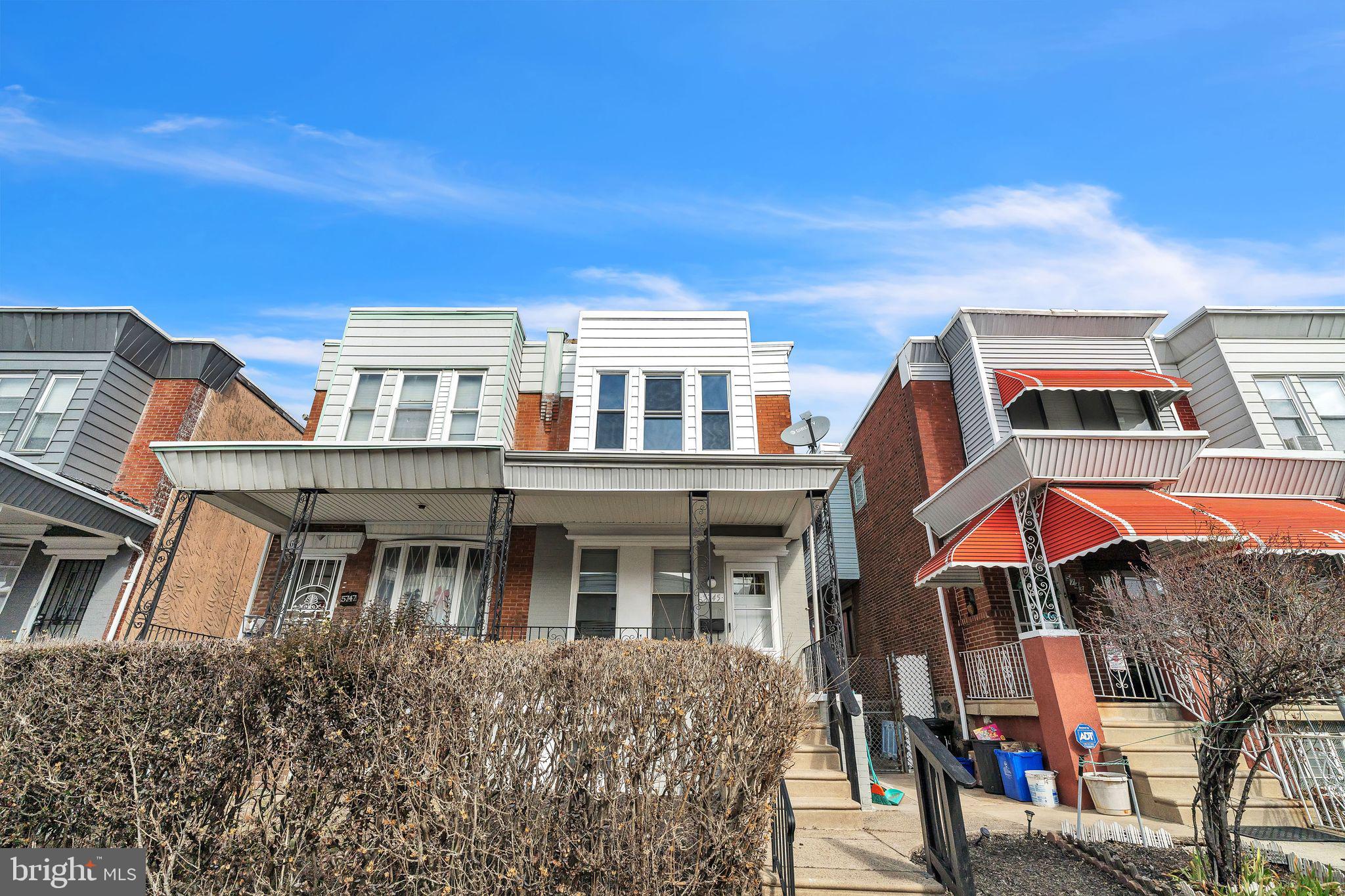 5745 Addison Street Philadelphia, PA 19143 - Photo 1 of 24 a front view of a house with balcony and outdoor seating