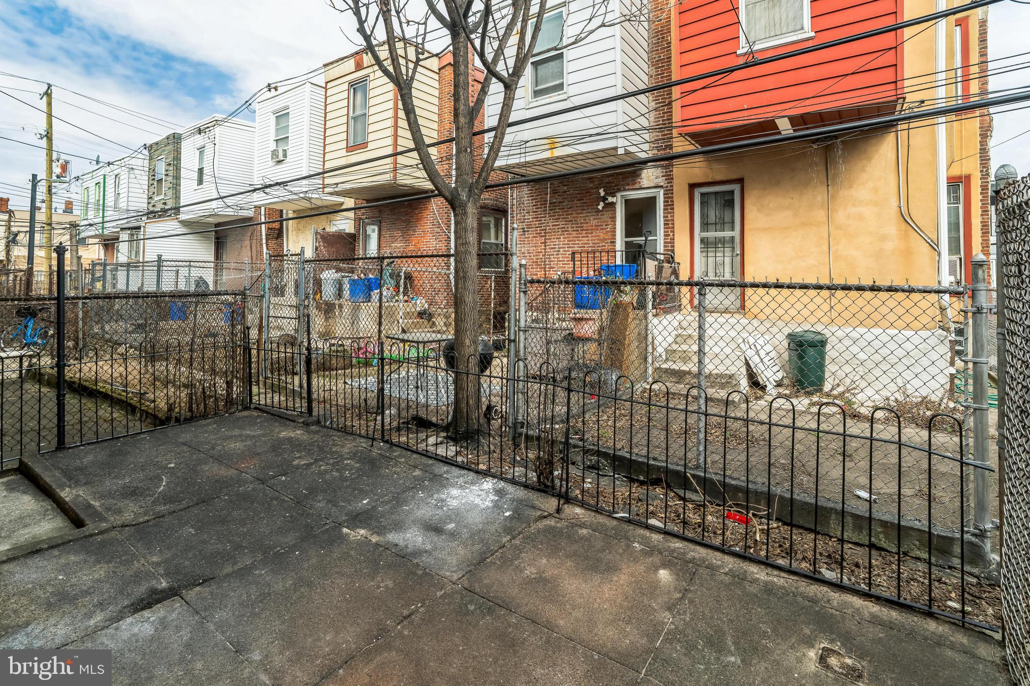 5745 Addison Street Philadelphia, PA 19143 - Photo 14 of 24 a view of a brick house with large windows