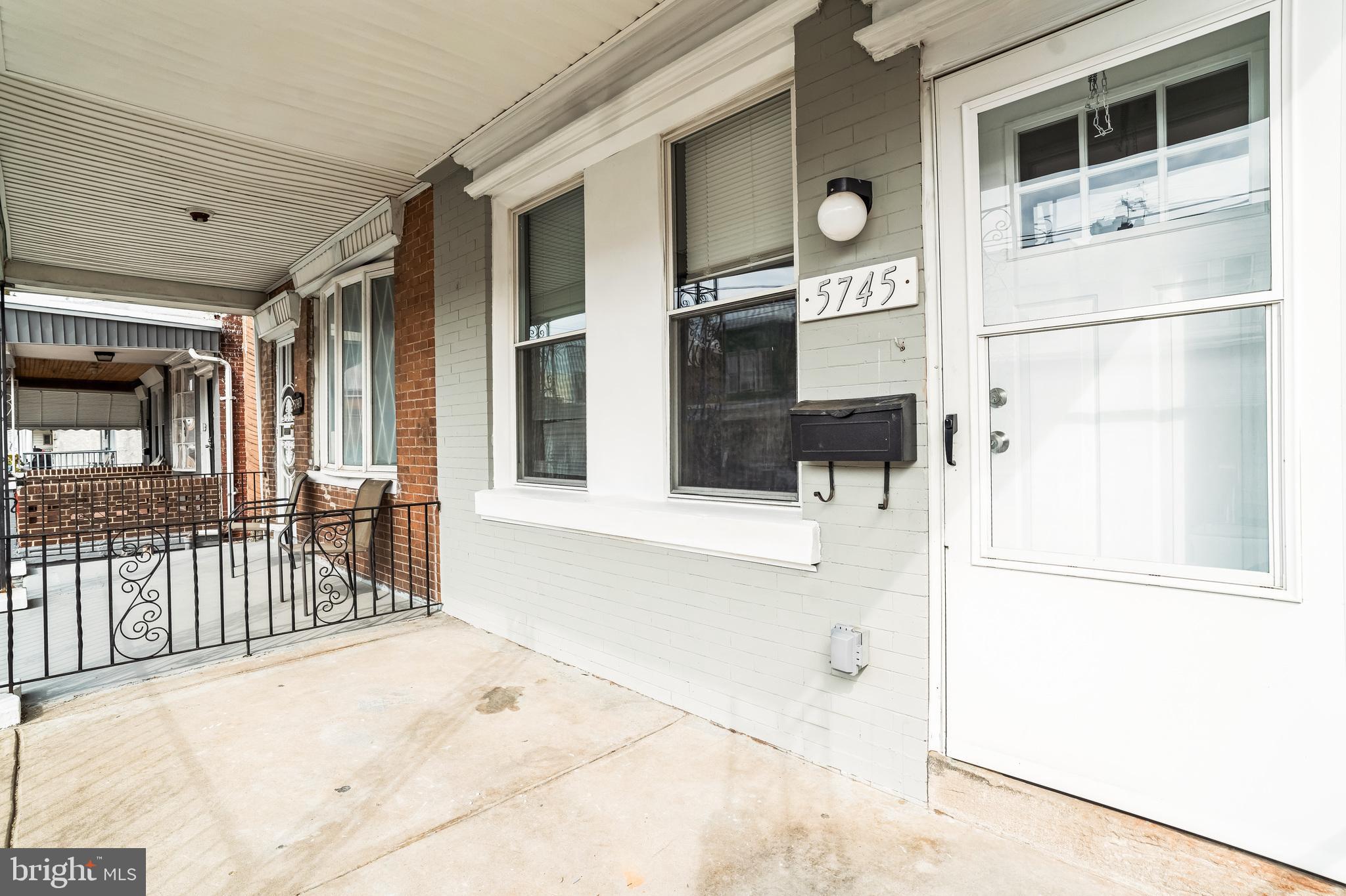 5745 Addison Street Philadelphia, PA 19143 - Photo 2 of 24 a view of a brick house with a large window