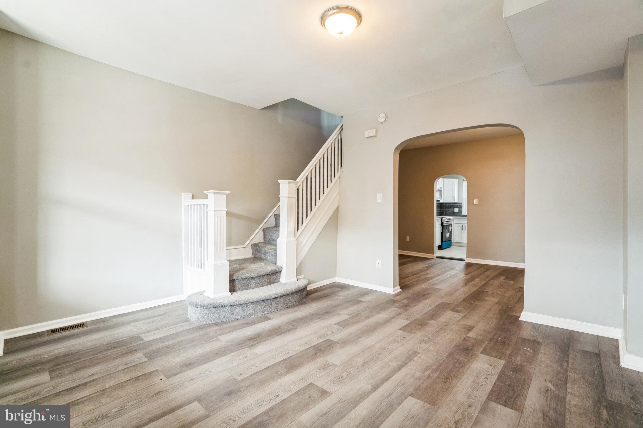 5745 Addison Street Philadelphia, PA 19143 - Photo 5 of 24 a view of entryway and hall with wooden floor
