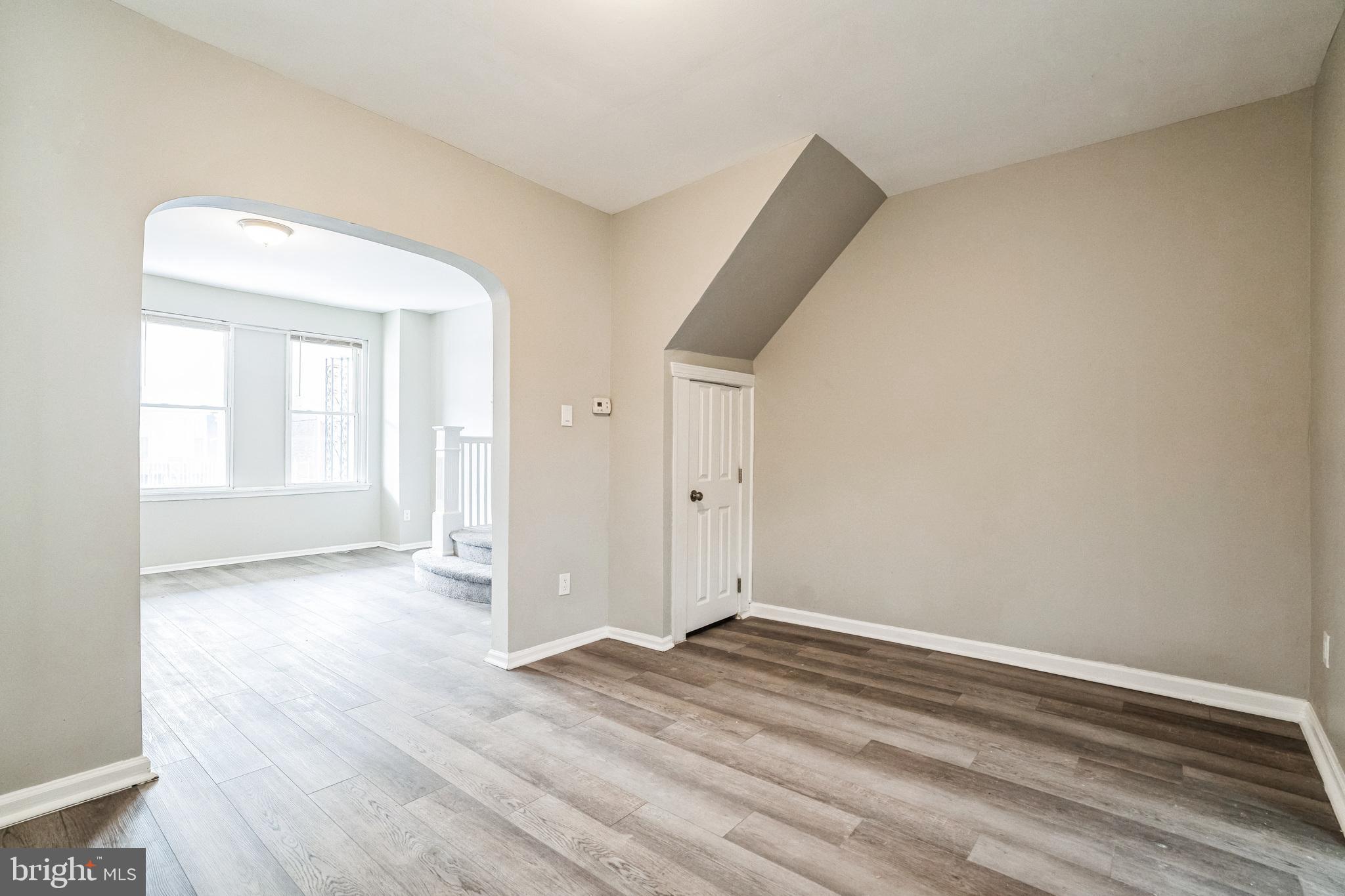 5745 Addison Street Philadelphia, PA 19143 - Photo 10 of 24 an empty room with wooden floor and windows