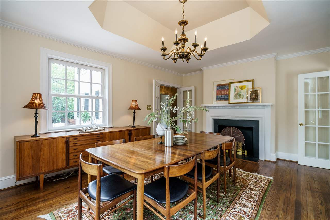 1501 St Marys Street Raleigh, NC 27608 - Photo 9 of 30 Formal dining with fireplace...imagine the memorable holiday dinners here. French doors enclose the space for festive affairs. Dining Room