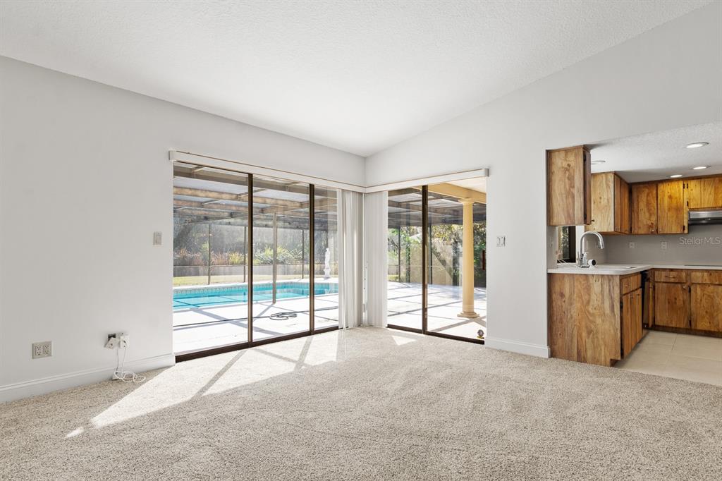 10206 Lakeview Drive New Port Richey, FL 34654 - Photo 15 of 53 a view of a room with a large window