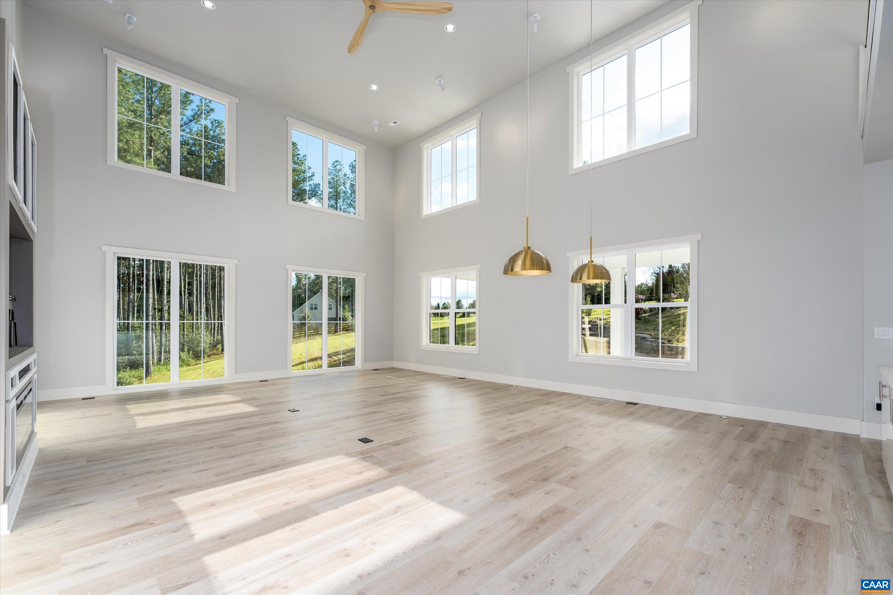 199 Ridgeview Drive Ruckersville, VA 22968 - Photo 18 of 72 an empty room with windows and entrance