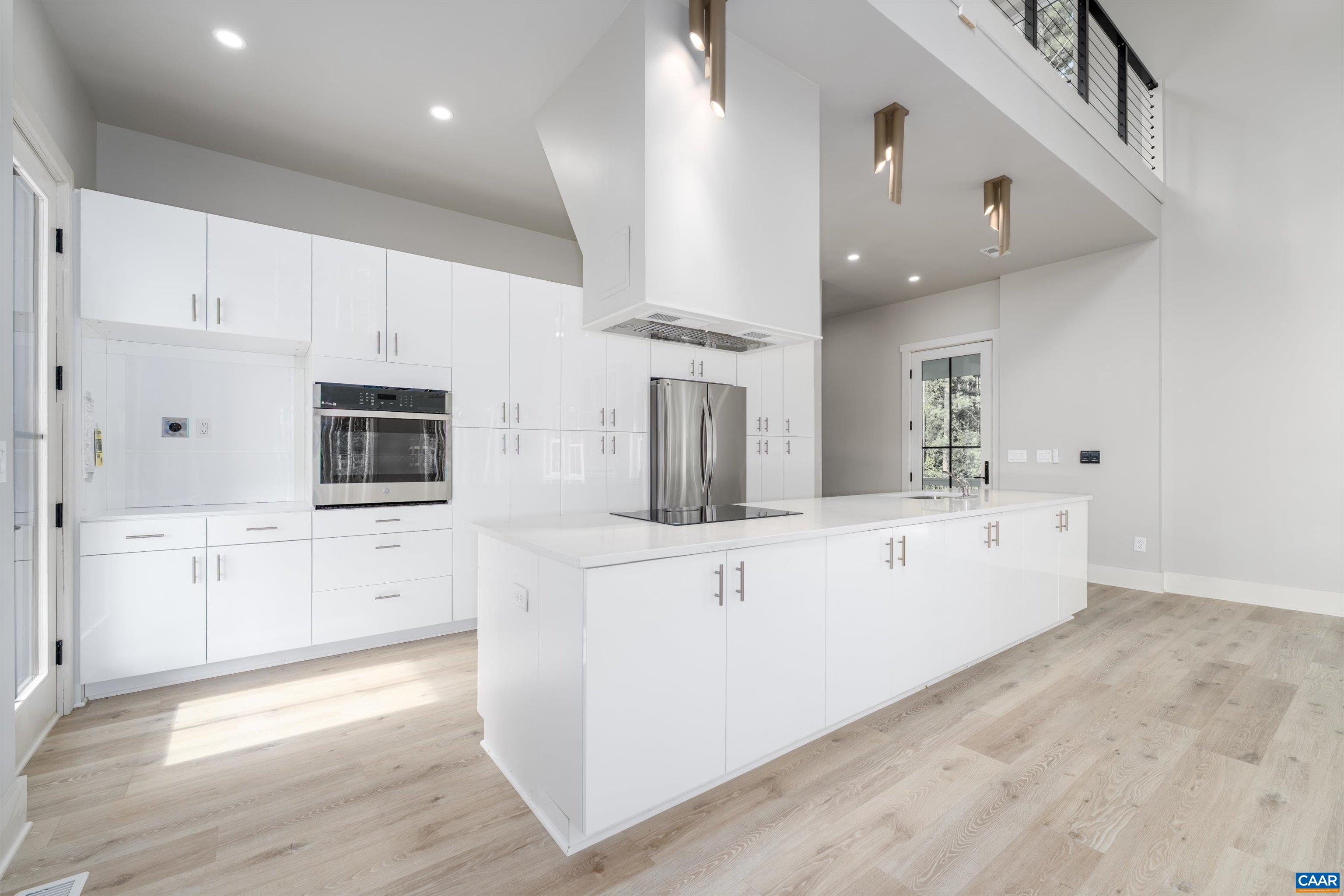 199 Ridgeview Drive Ruckersville, VA 22968 - Photo 24 of 72 a large white kitchen with stainless steel appliances