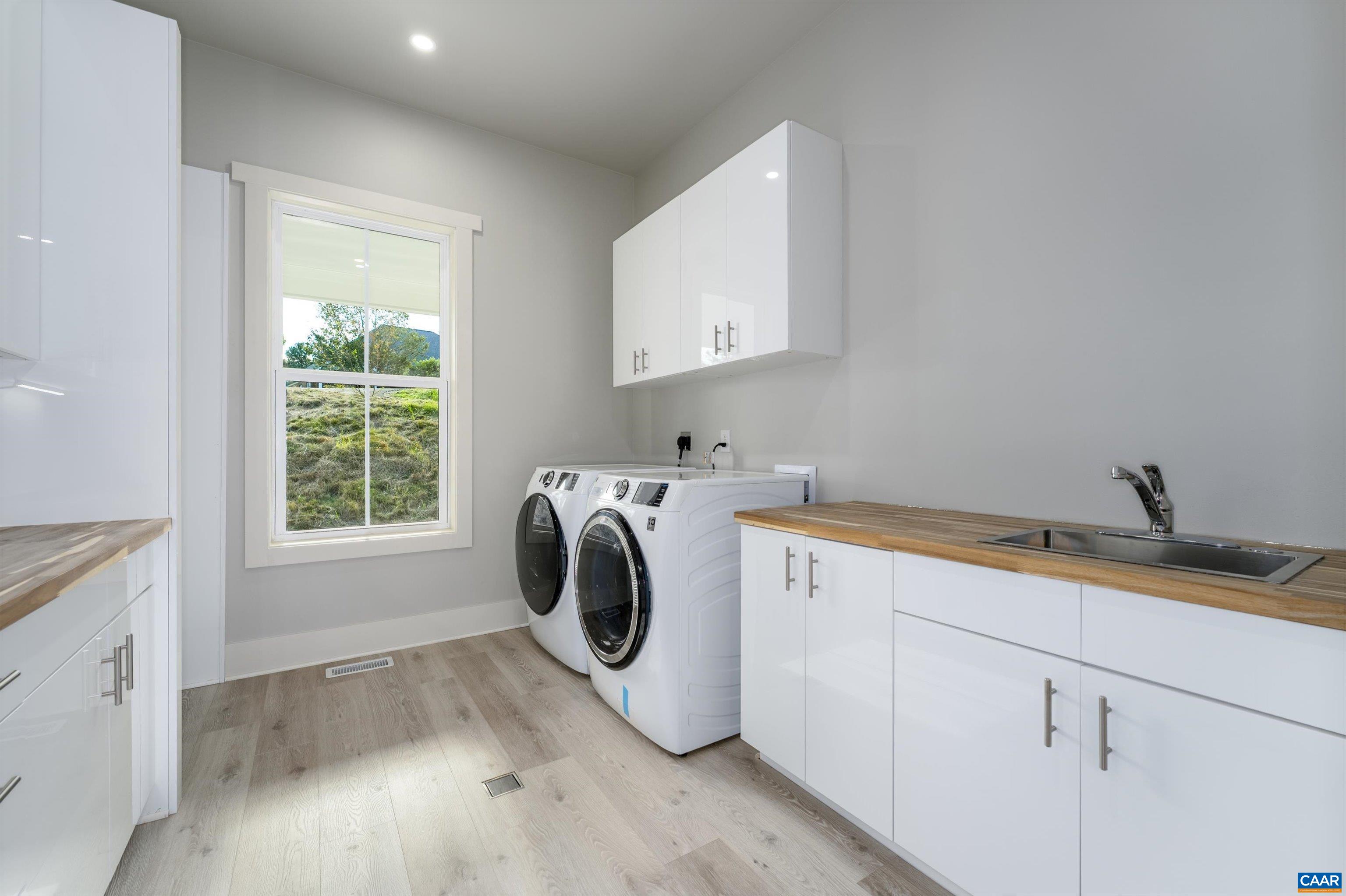 199 Ridgeview Drive Ruckersville, VA 22968 - Photo 37 of 72 a utility room with sink dryer and washer