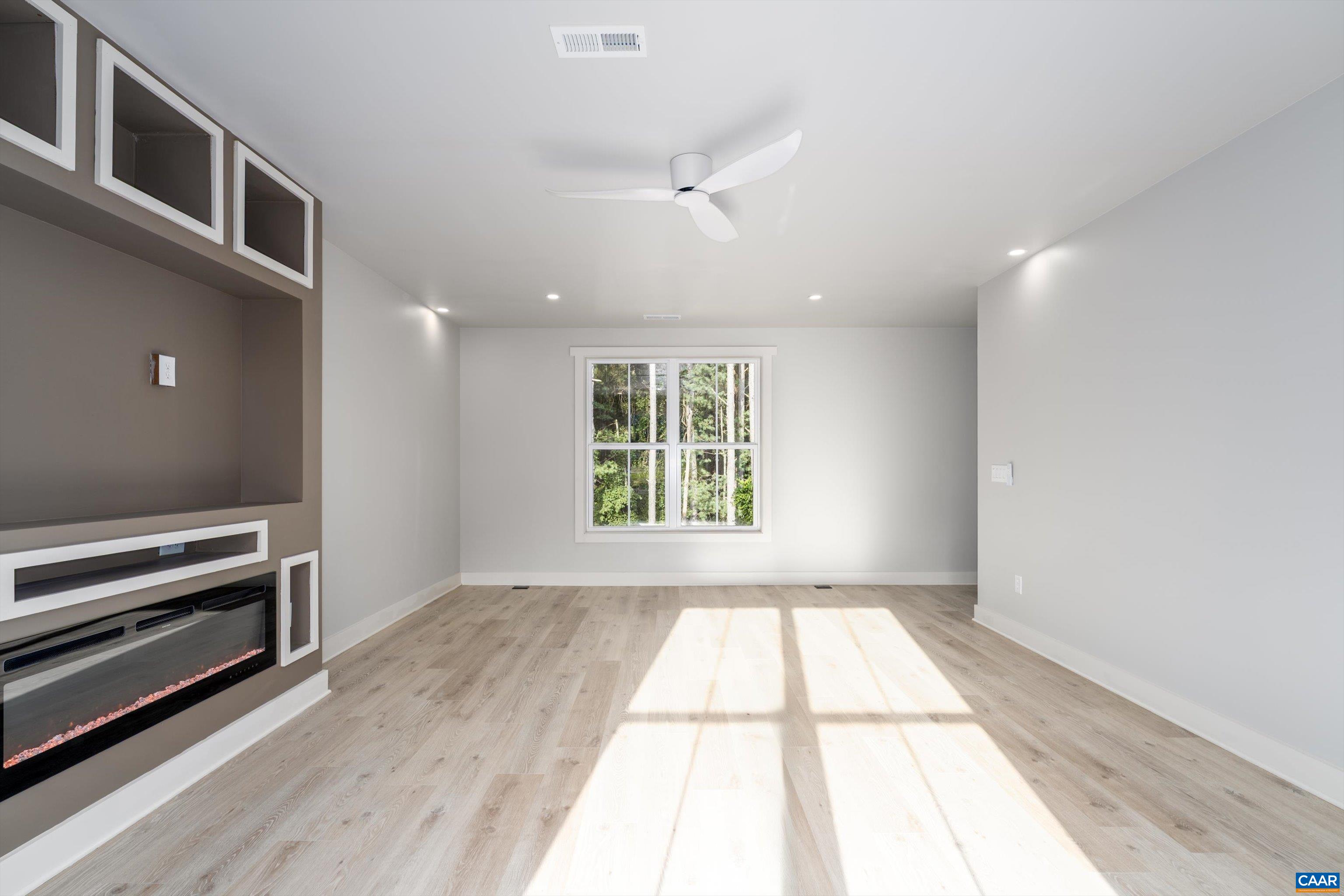 199 Ridgeview Drive Ruckersville, VA 22968 - Photo 58 of 72 a view of an empty room with a window and wooden floor