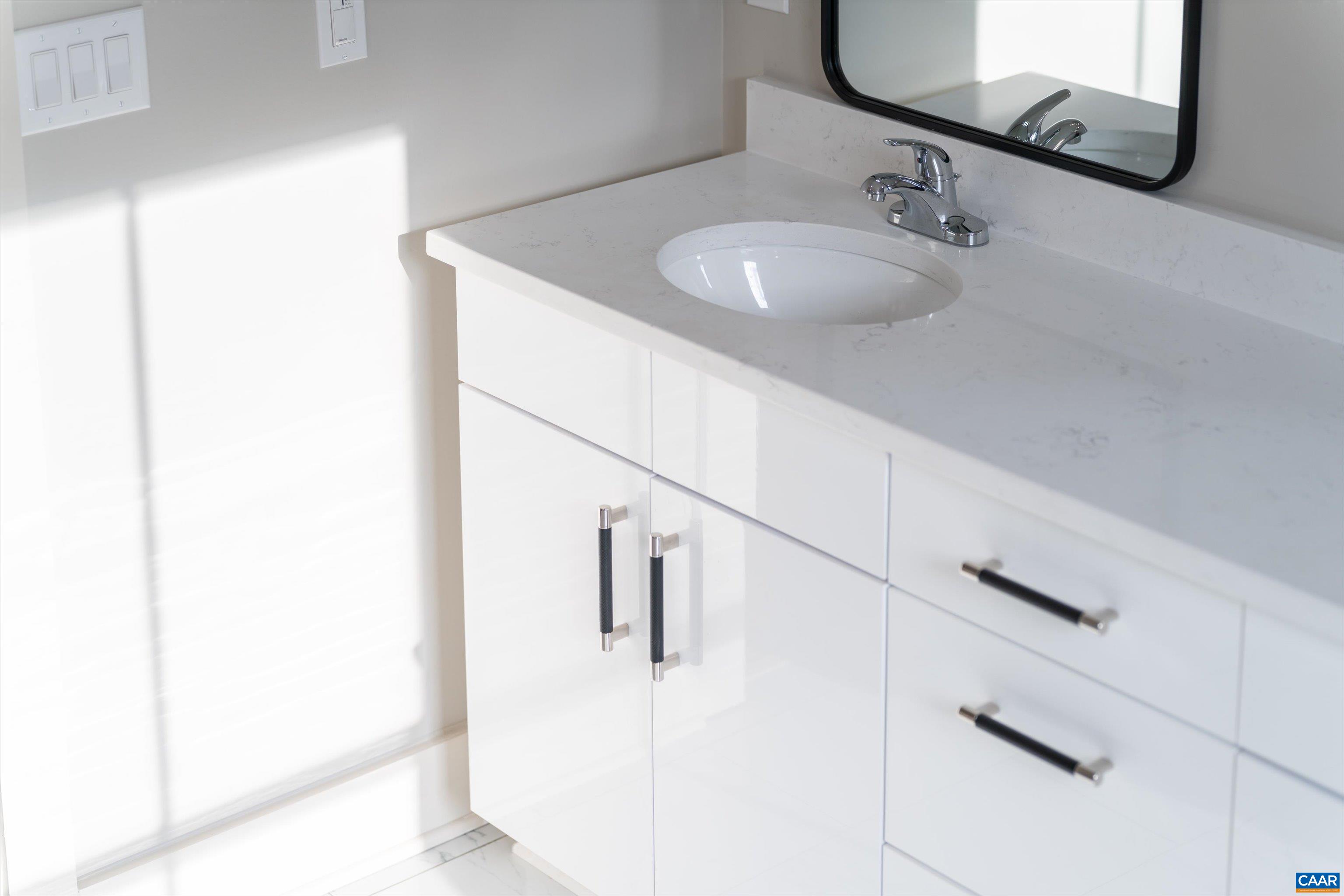 199 Ridgeview Drive Ruckersville, VA 22968 - Photo 62 of 72 a bathroom with a sink and mirror