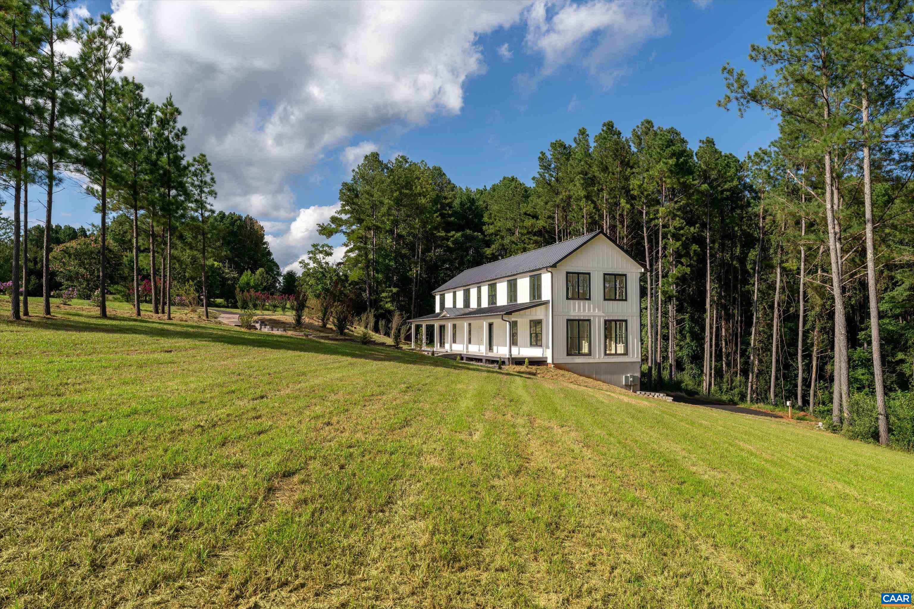 199 Ridgeview Drive Ruckersville, VA 22968 - Photo 64 of 72 a house with huge green field in front of it