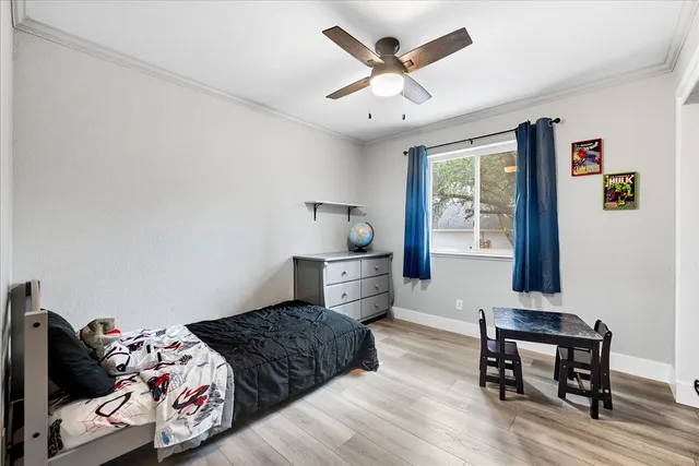 a bedroom with a bed and a table in it