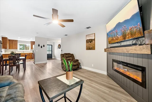 a living room with furniture and a fireplace