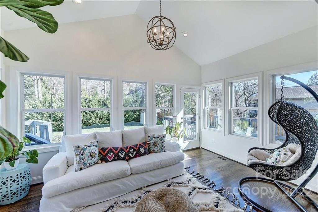 3421 Park Road Charlotte, NC 28209 - Photo 13 of 40 a living room with furniture gym equipment and a large window