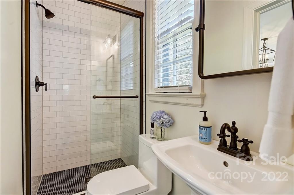 3421 Park Road Charlotte, NC 28209 - Photo 18 of 40 a bathroom with a sink toilet and shower
