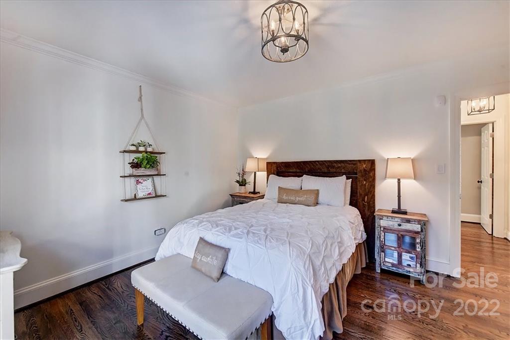 3421 Park Road Charlotte, NC 28209 - Photo 26 of 40 a bedroom with a bed and wooden floor