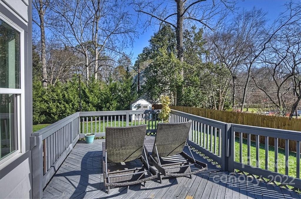 3421 Park Road Charlotte, NC 28209 - Photo 30 of 40 a view of a chair and table on the deck