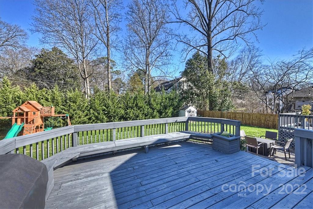 3421 Park Road Charlotte, NC 28209 - Photo 34 of 40 a balcony with wooden floor and trees