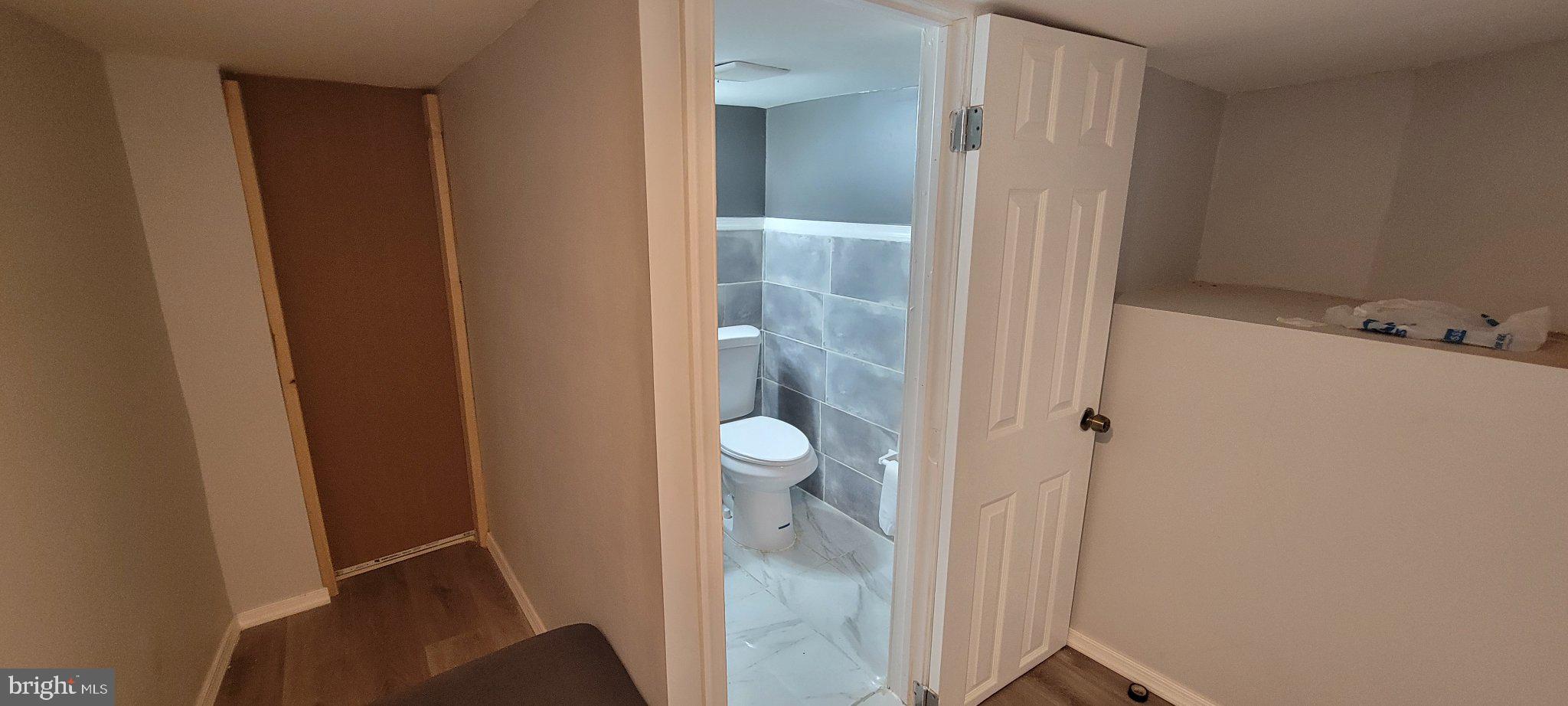 209 North 10th Street Darby, PA 19023 - Photo 12 of 26 Cozy nook with modern bathroom access.