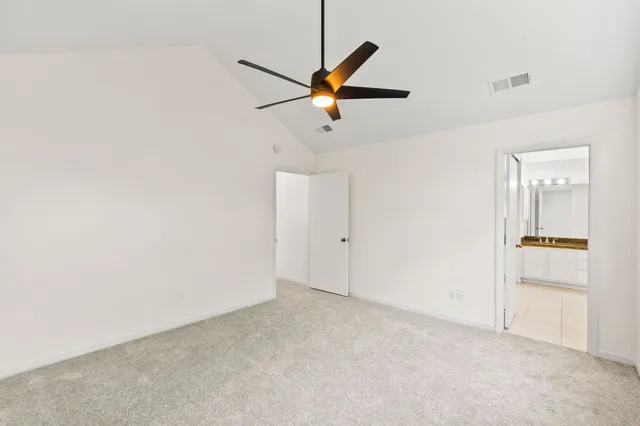 a view of a ceiling fan and a ceiling fan