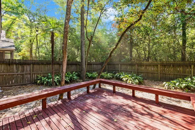 a view of a balcony with wooden floor