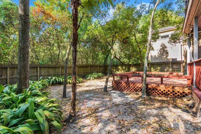 a view of a bench in the backyard
