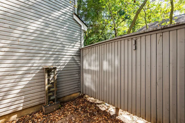 a view of a backyard with a chair