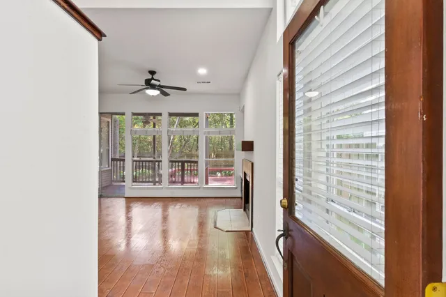 a view of an entryway with wooden floor