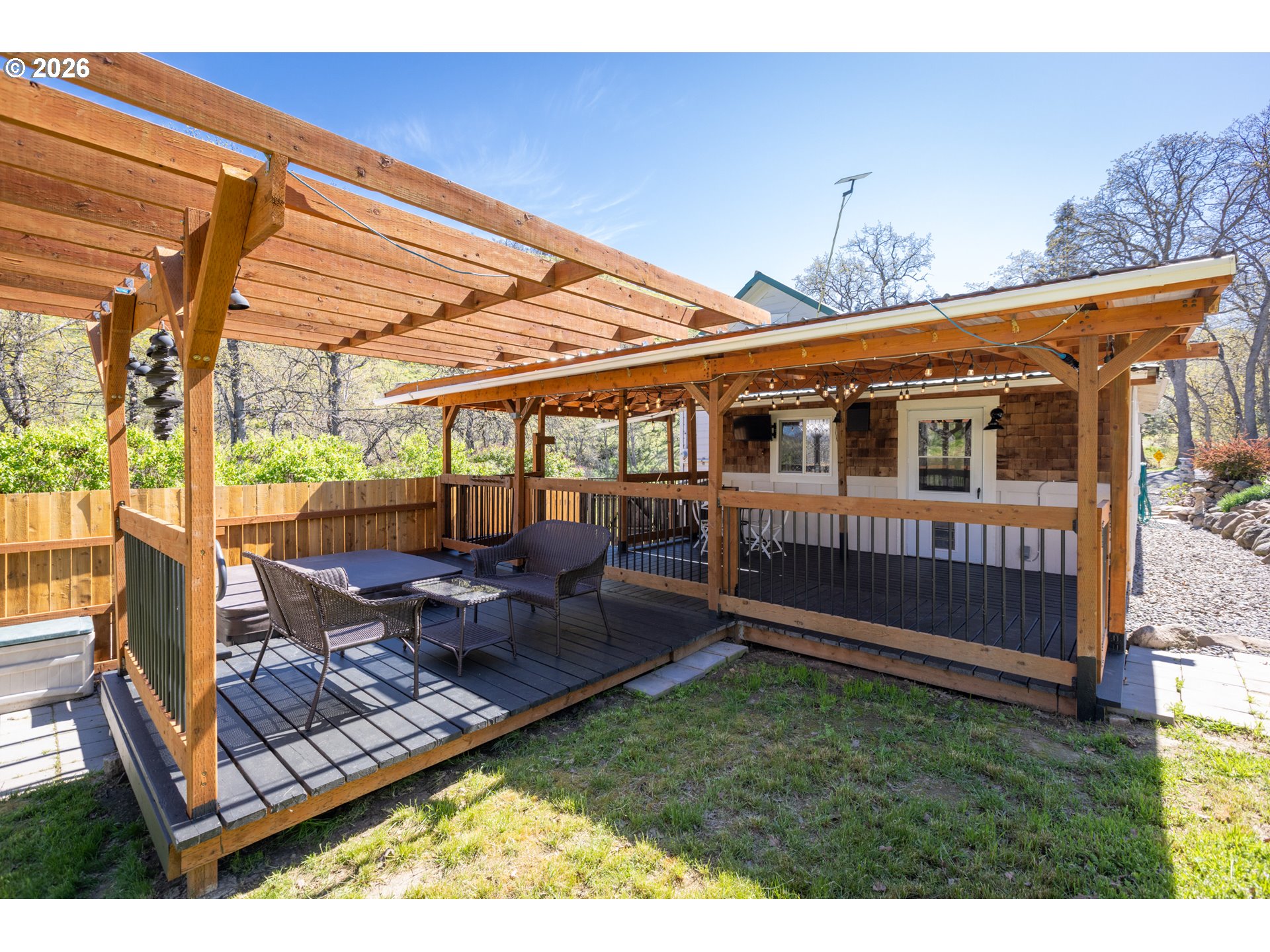 4625 Orchard Road The Dalles, OR 97058 - Photo 14 of 31 a view of a house with backyard and porch