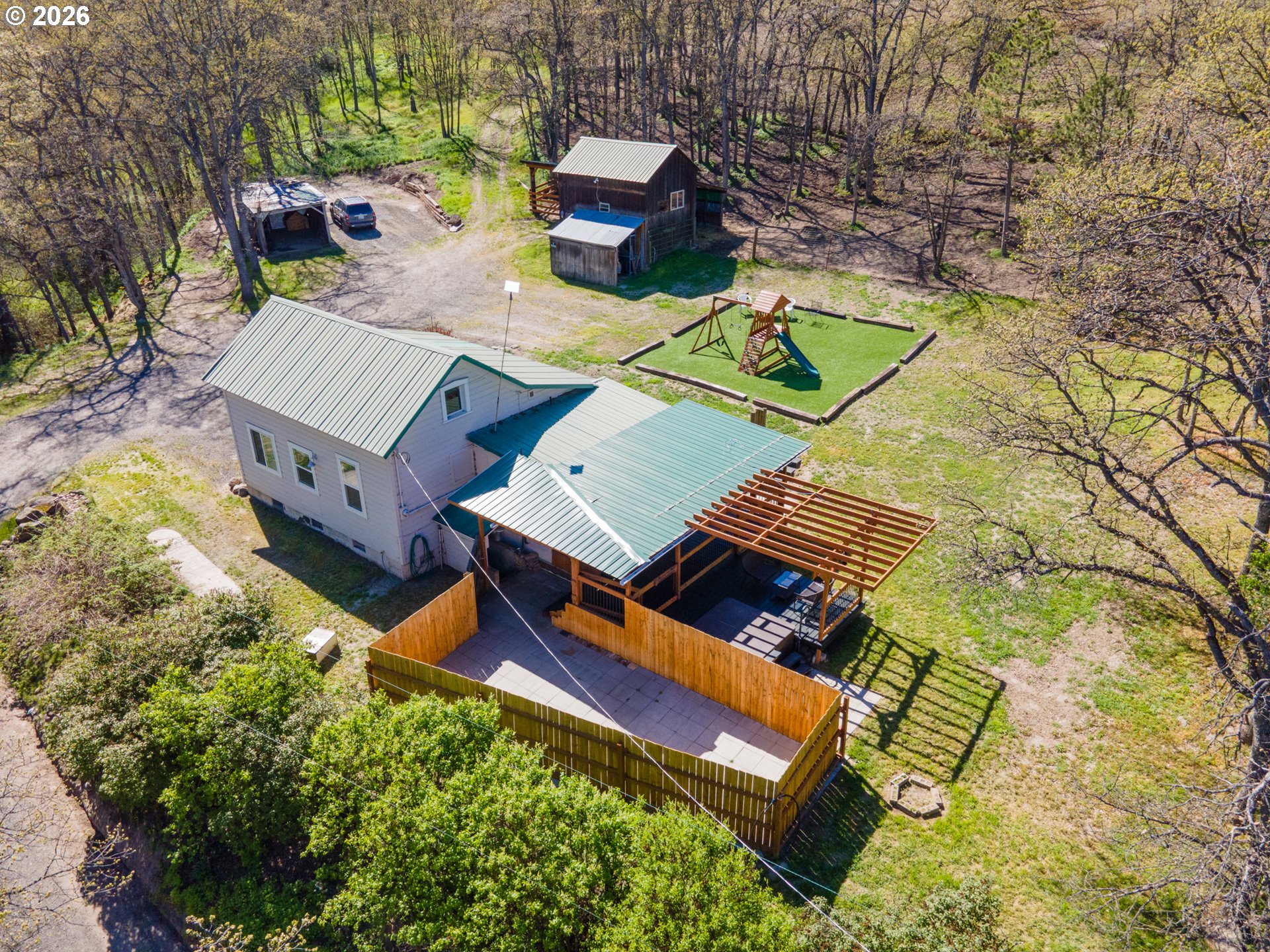 4625 Orchard Road The Dalles, OR 97058 - Photo 23 of 31 an aerial view of a house with a yard
